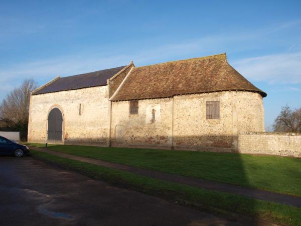 Blue skies cover the old priory at Isleham